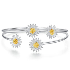 Bangle with daisy flower designs on a white background