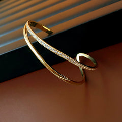 Gold-tone Celeste open cuff bracelet with clear zirconia stones
