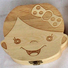 Wooden box shaped like a girl's face with a bow on her head, on a white background.
