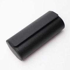 Closed black three-slot travel watch case on a white background
